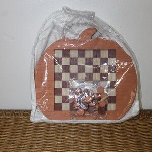 Pumpkin-shaped wooden checkers set